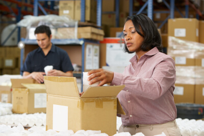 Woman in warehouse fulfilling an order